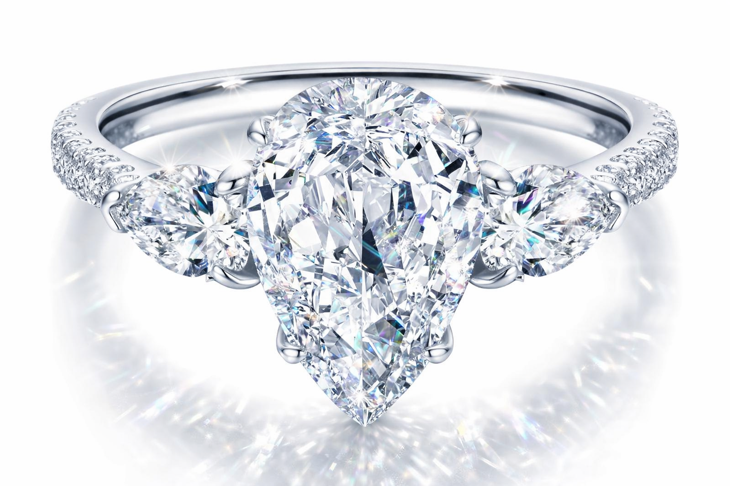 Château de Grâce — Pear-Cut Three-Stone Prestige Setting